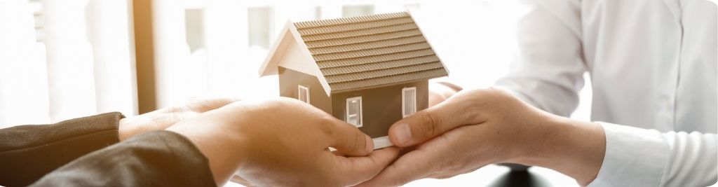 Homeowners reviewing MLS real estate listings and preparing for a successful house sale